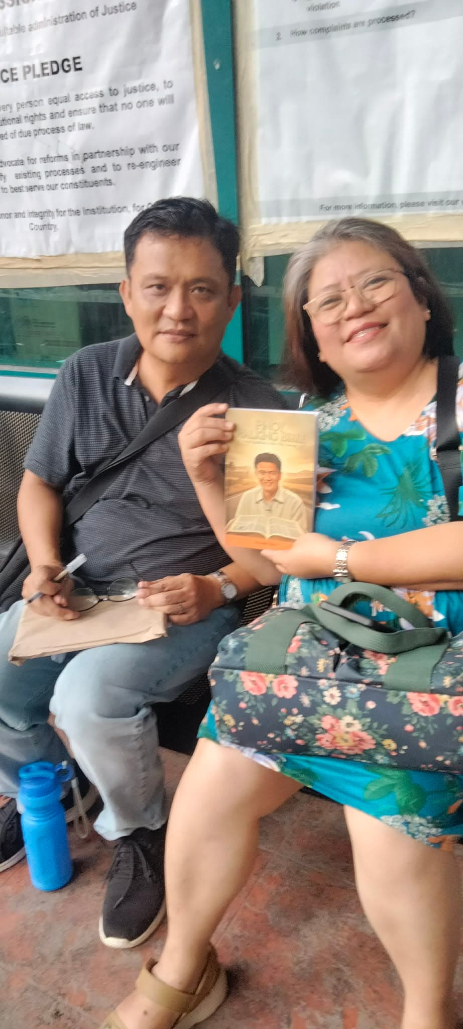 Ministry volunteer sharing Pinoy Walking Bible materials with a visitor
