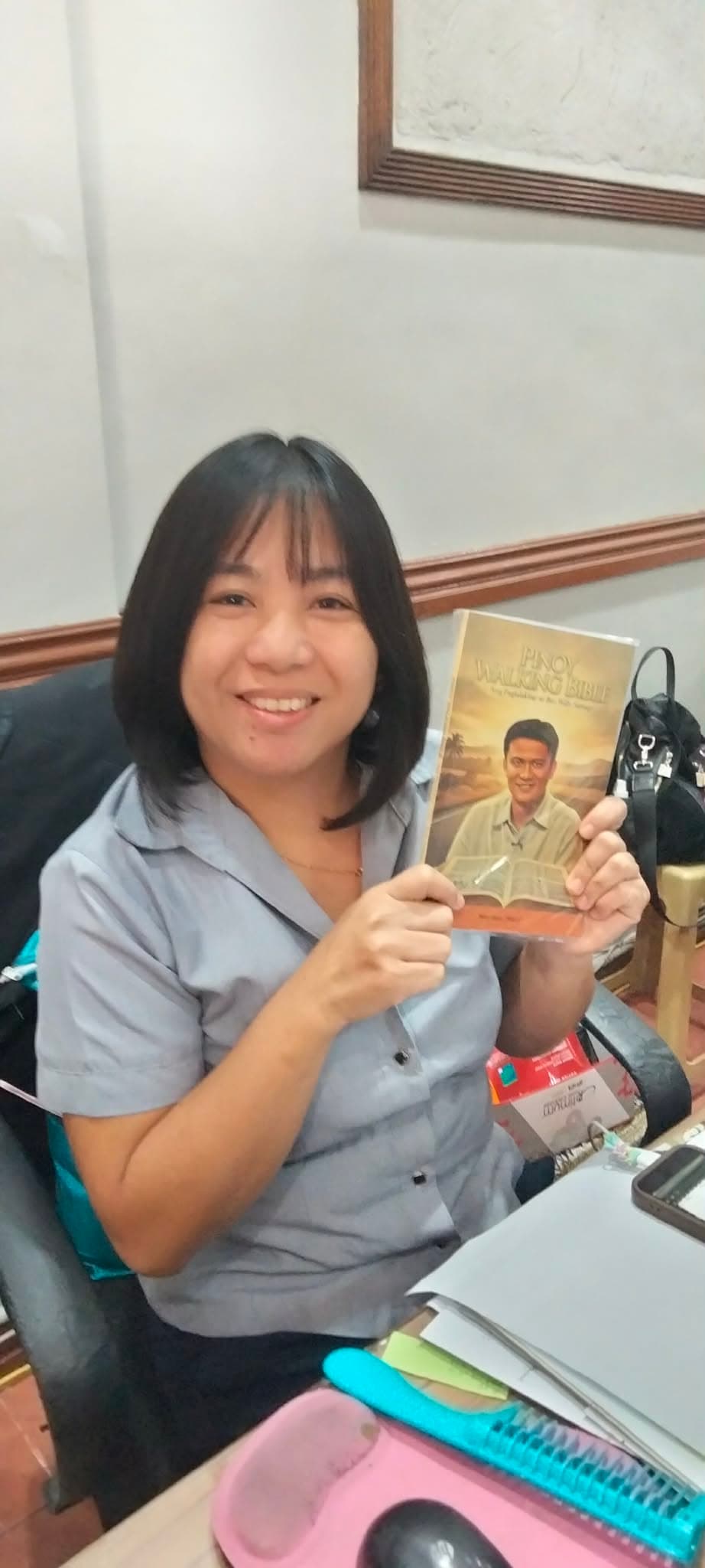Portrait with the Pinoy Walking Bible held up beside Bro. Willie Santiago on the cover
